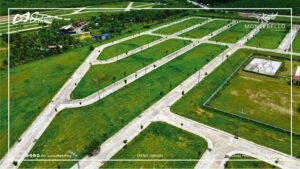 Aerial view of residential lots, concrete roads, and landscaped areas at Montebello Residences
