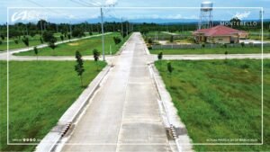 Elevated view of the internal road, landscaped surroundings, and residential lots at Montebello Residences